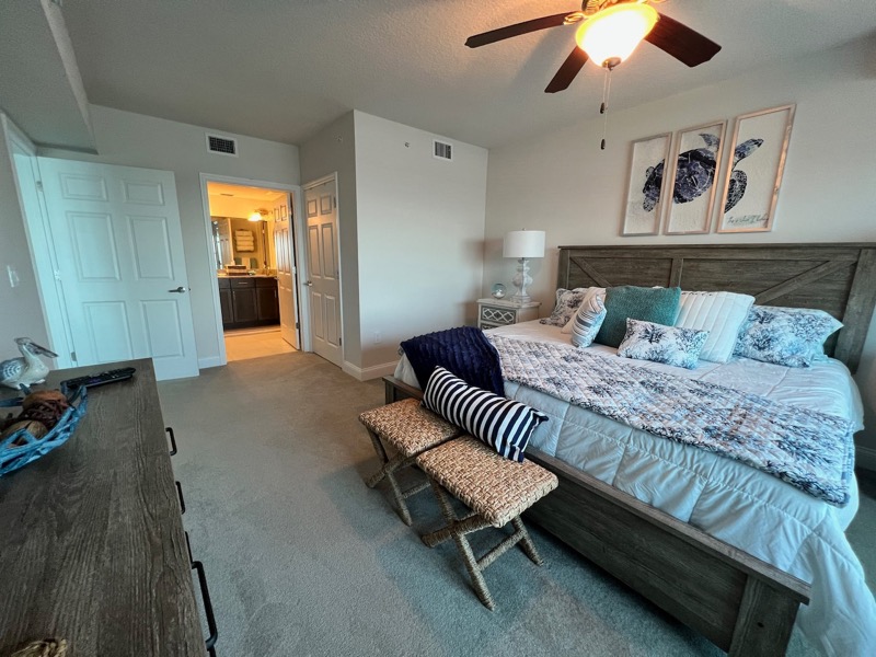King bedroom with coastal decor at Aruba 705